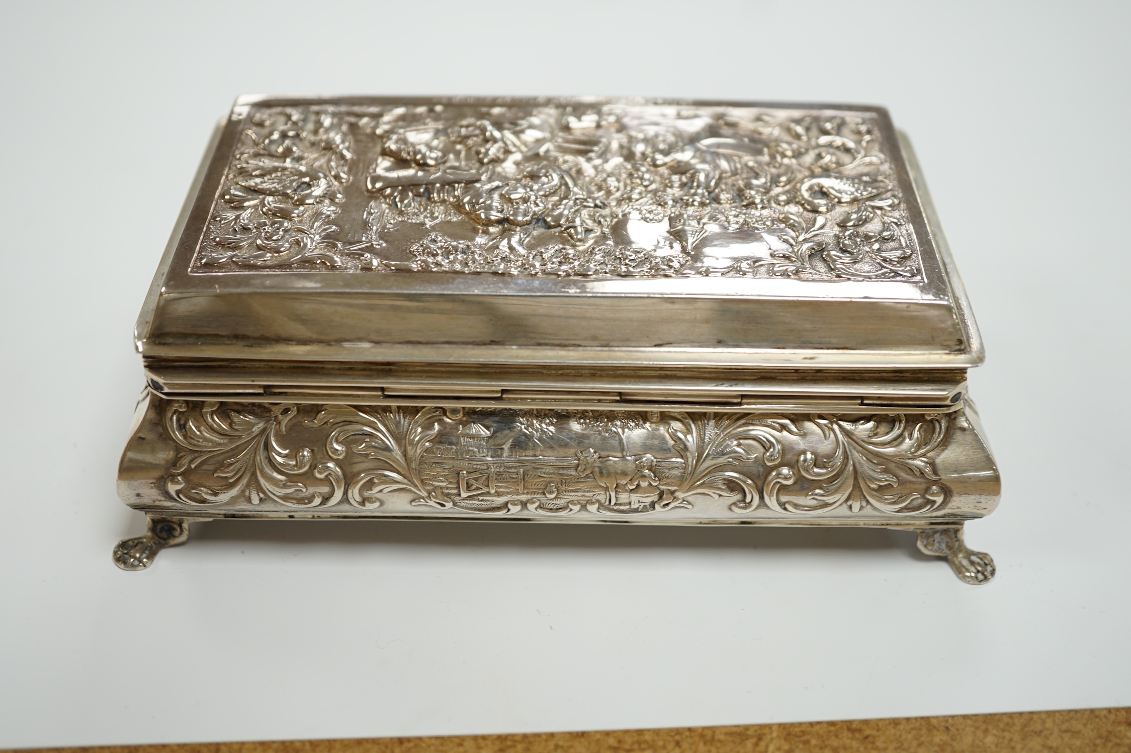 A late 19th century Dutch white metal bombe shaped rectangular trinket box, 14cm, together with an Edwardian silver trinket box, London, 1908.